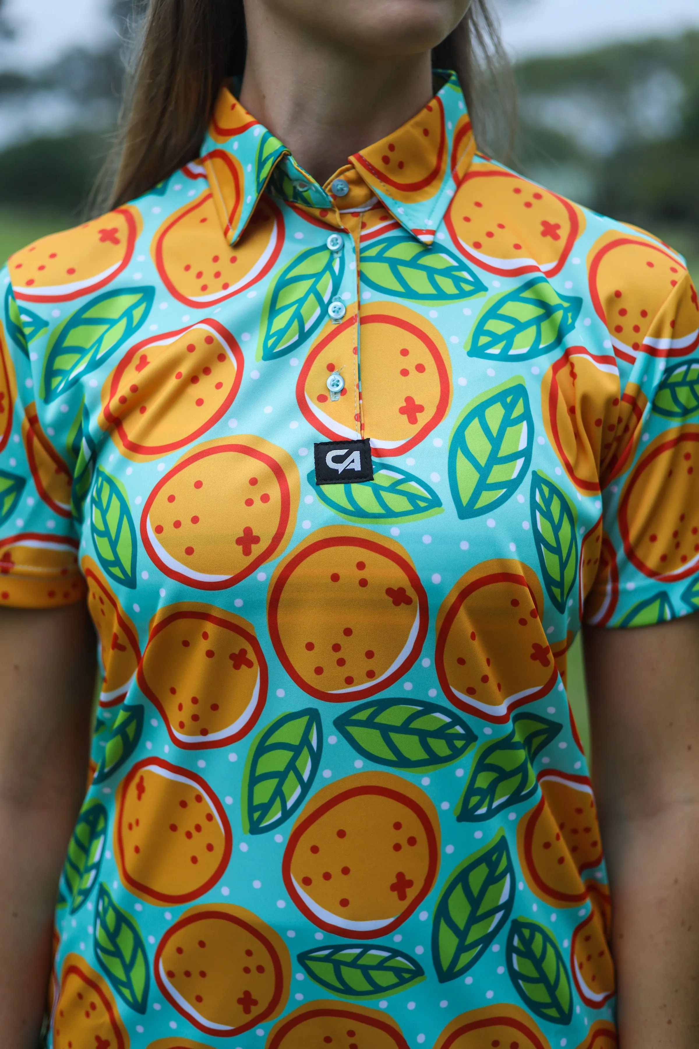 CA Ladies Funky Golf Shirt | Turquoise Oranges